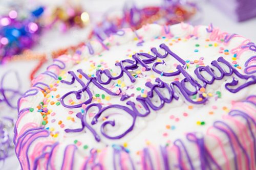 purple birthday cake on a table